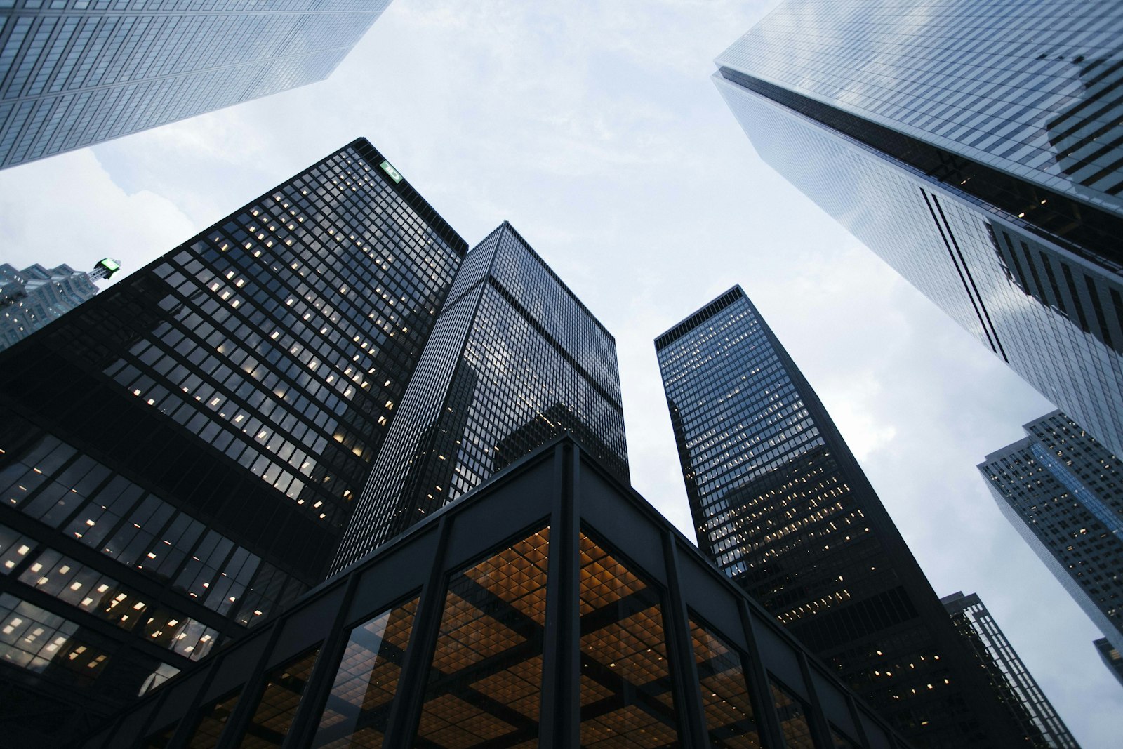 Office towers seen from street level at dusk